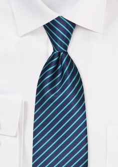 Necktie Product Details:
Handmade from woven microfiber
· Standard length of 58"
· Classic width of 3.1"
· Repp woven stripe design in navy and turquoise
· Also available as matching pocket squares, skinny ties, and pocket squares
· Pair with all classic suits and sports coats
· Shipping weight: 2.0oz Ties Mens