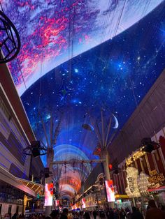 the ceiling is covered in colorful lights and stars