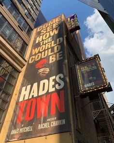 a large sign on the side of a building that says hads town in front of it