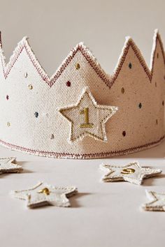 a white crown with stars on it