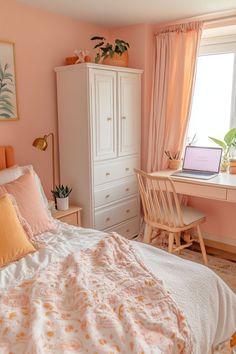 a bedroom decorated in pink and orange with a bed, desk, chair, and window