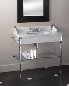 a bathroom with a sink and mirror in it