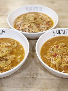 three white bowls filled with different types of food