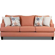 an orange couch with pillows on it