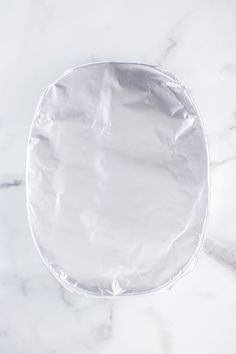 an empty plastic plate on a marble surface