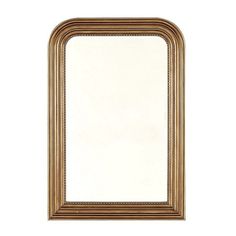 a gold framed mirror on a white wall