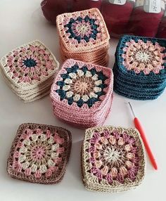 crocheted grannys are arranged on a table