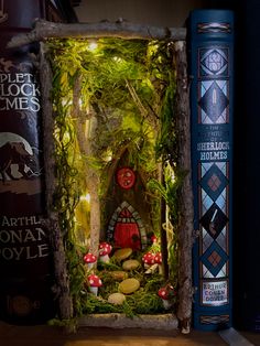 a fairy house made out of wood with moss and mushrooms in the doorway, surrounded by books