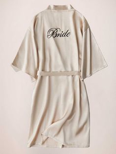 This elegant satin morning robe is a must-have for any bride. With its elegant sleeves and luxurious fabric, it's perfect for getting ready on your special day. Feel comfortable and stylish while you prepare to walk down the aisle. Start your wedding day off right with this beautiful robe.

Material: Polyester Fiber (Polyester)
Sleeves: Short SleevesClosure: Front ClosureNote: Final Sale & No Returns Elegant Long Sleeve Robe For Bridal Shower, Cream Satin Robe For Wedding Night, Elegant Satin Bridesmaid Robe, Satin Wedding Robe, Wedding Satin Robe, Cream Silk Kimono For Wedding, Elegant Bridesmaid Robe With Satin Finish, Long Sleeve Cream Robe For Wedding, Cream Long Sleeve Wedding Robe