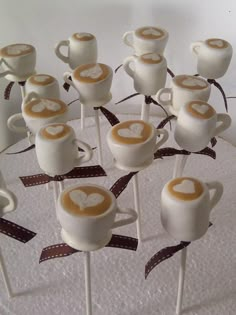 there are many marshmallows in the shape of coffee mugs on sticks