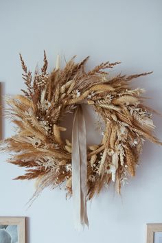 a dried wreath is hanging on the wall