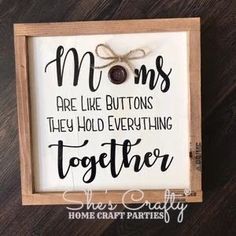 a framed sign with the words moms are like buttons they hold everything together on it