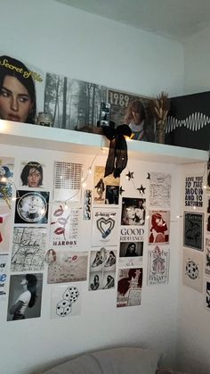 there is a wall with many pictures on it