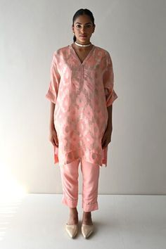 Rose pink straight kaftan style tunic with all over floral brocade pattern and side pockets. Paired with a cigarette pant. - Aza Fashions Pink Straight Kurta Kaftan For Festive Occasions, Festive Pink Straight Kurta Kaftan, Elegant Pink Kaftan For Diwali, Festive Pink Set With Set-in Sleeves, Pink Tunic Kurta For Festive Occasions, Pink Tunic For Eid, Pink V-neck Diwali Kurta, Festive Pink V-neck Kurta, Festive Pink Straight Kurta Blouse