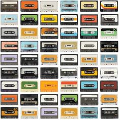 an assortment of cassette tapes in different colors and sizes, all lined up on top of each other