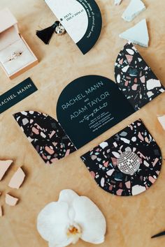 the wedding stationery is laid out on the table