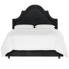 a bed with a brown headboard and white sheets on it's sides, in front of a white background