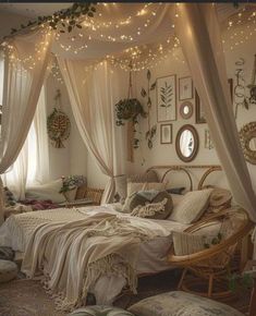 a bedroom with lights strung from the ceiling and curtains on the windowsills above it