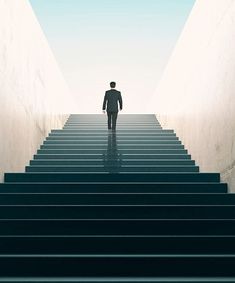 a man walking up some stairs towards the sky