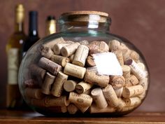 a glass jar filled with lots of wine corks