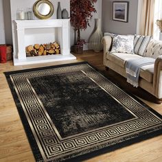 a living room filled with furniture and a rug on top of a hard wood floor