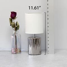 "Shop for this Simple Designs 11.5\" Ruffled Metallic Chrome Capsule Table Lamp at Michaels. com. A ruffled metallic chrome cylinder base is paired perfectly with a drum fabric shade in white, to compliment your current style in all room types, ranging from your bedroom, down to your personal office. What better way to add a little contemporary décor than to incorporate a burst of metallic flavor into your lighting needs? A ruffled metallic chrome cylinder base is paired perfectly with a drum fa Personal Office, Current Styles, Furniture Removal, Drum Shade, Fabric Shades, Room Types, Contemporary Decor, Table Desk, Accent Pieces