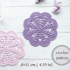 two crochet doily patterns on a white wooden table with flowers and pearls