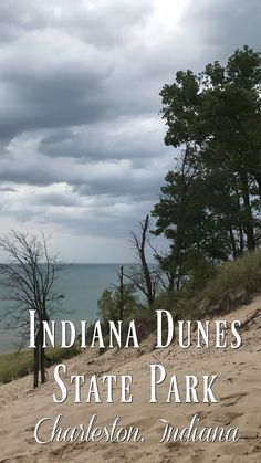 there is a sign that says indiana dunes state park charleston, indiana on the beach