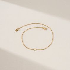 Capella This celestial spark of a bracelet captures the magic of the night sky in a dainty and sophisticated design. The bracelet features a tiny, hand-crafted solid gold star charm that dangles from a shimmering gold chain. Available in 14k yellow, rose, or white gold, this bracelet is perfect for everyday wear or adding a touch of starlight to a special occasion. - Handmade- Solid Gold- The Dimension of Star: 5.5 mm All pieces come beautifully boxed in suede pouches you can always use when tra Tiny Hand, Star Bracelet, White Gift Boxes, Gold Star, Sophisticated Design, Colorful Bracelets, Gold Set, Star Charms, Yellow Rose