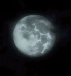 the full moon is seen in black and white