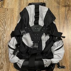 a large backpack sitting on top of a wooden floor