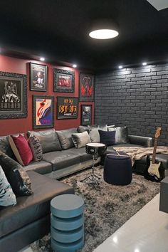 a living room filled with lots of furniture and pictures on the wall above it's couches