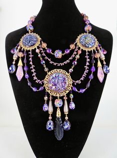 Absolutely Frivolous purple lady & floral Art Nouveau necklace with my original lustre glass features and beads, antique 1920s drops, facetted amethyst hand beaded chains, Swarovski tanzanite drops,  lampwork drops & beads, gold plated filigrees with added patina, lobster clasp with tag, extender chain Purple Czech Glass Jewelry For Party, Antique Beaded Jewelry With Czech Glass, Party Jewelry In Purple Czech Glass, Handmade Jewelry With Round Beads For Mardi Gras, Ornate Handmade Purple Jewelry, Handmade Round Beads Jewelry For Mardi Gras, Purple Jewelry For Mardi Gras, Handmade Beaded Jewelry For Mardi Gras, Purple Beaded Jewelry For Mardi Gras