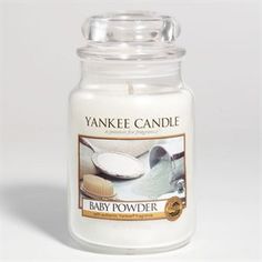 a yankee candle is shown with an image of a baby powder on the front and side