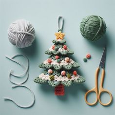 crocheted christmas tree ornament next to yarn and scissors