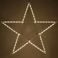 a lighted star hanging from the ceiling