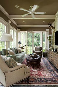 a living room filled with furniture and a flat screen tv