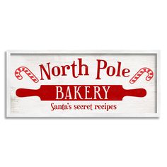 a sign that says north pole bakery santa's secret recipes on the side of it