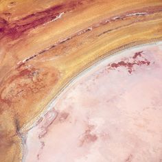 an aerial view of the desert with brown and yellow colors on it's surface