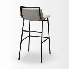 an upholstered bar stool with black frame and fabric seat, on a white background