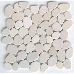 white pebbles are arranged on a white surface