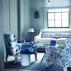 a living room with blue and white furniture