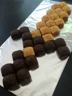 several pieces of cake sitting on top of a piece of white paper next to each other