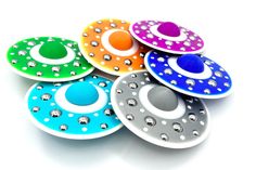 six different colored discs with holes on them