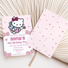 a hello kitty birthday party with pink and white hearts on the paper, matchessticks