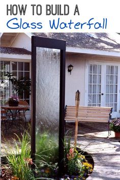 a water fountain in front of a house with the words how to build a glass waterfall