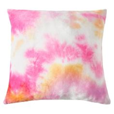 a pink and yellow tie dyed pillow on a white background