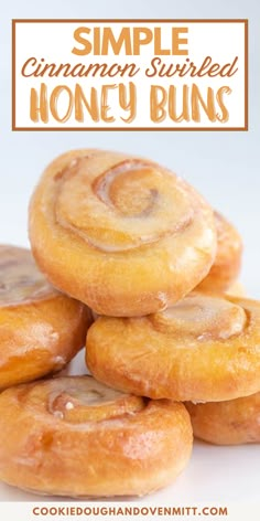 cinnamon swirled honey buns stacked on top of each other with text overlay