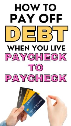 two hands holding credit cards with the text how to pay off debt when you live paycheck to paycheck