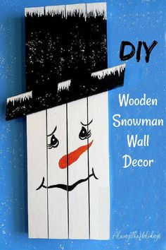 a wooden snowman wall decoration with the words diy painted on it's face